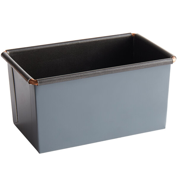 A rectangular metal container with a black rim.