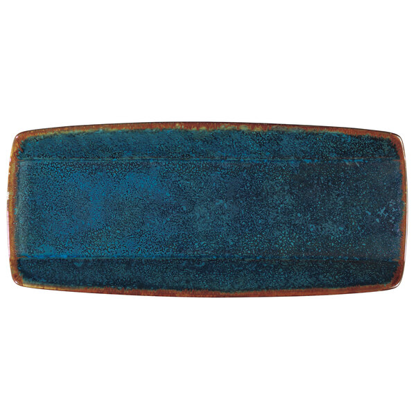 A close-up of a blue rectangular Oneida Studio Pottery Blue Moss porcelain sushi plate with brown edges.