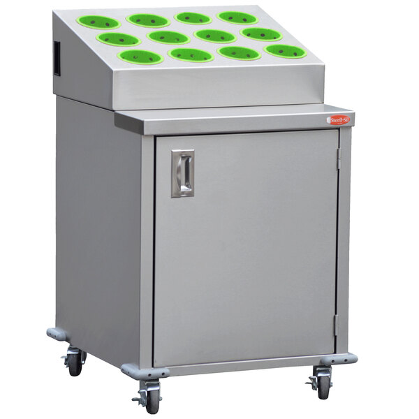 A large stainless steel cabinet with green circles and white boxes inside.