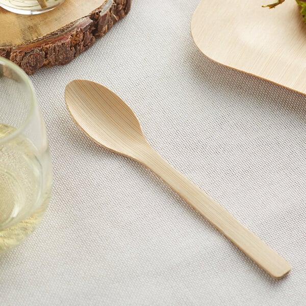 A Bamboo by EcoChoice compostable bamboo spoon on a table.