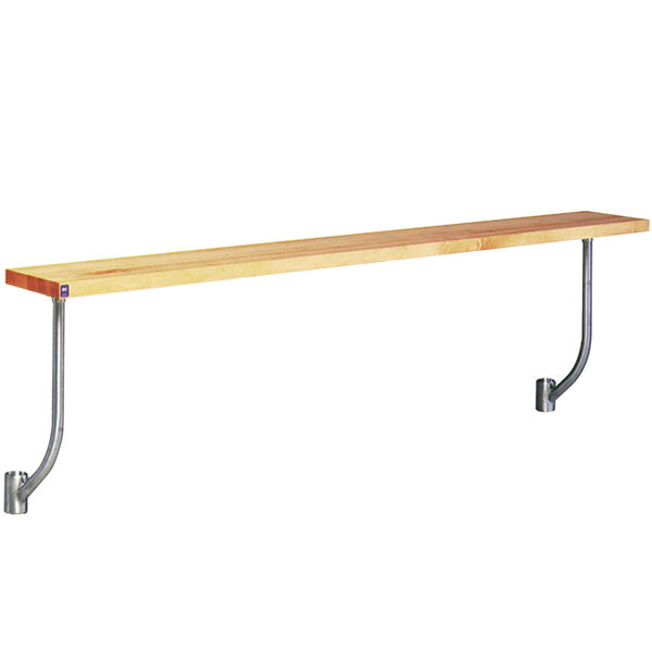 An Eagle Group adjustable height cutting board on metal brackets over a work table.