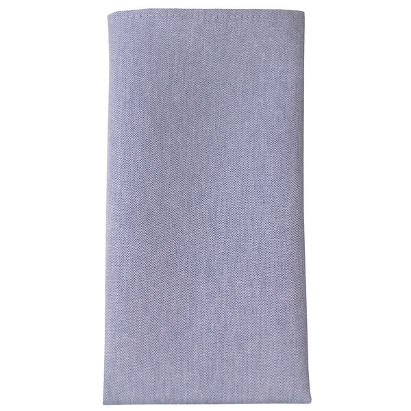 A close-up of a solid blue chambray cloth napkin.