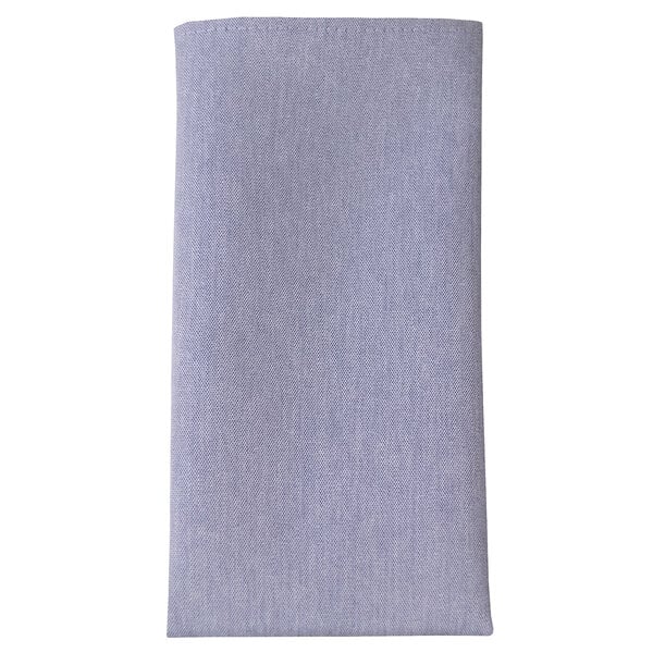 A close-up of a blue chambray fabric napkin.