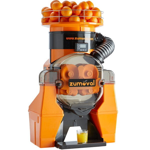 A Zumoval orange juice machine with oranges inside.