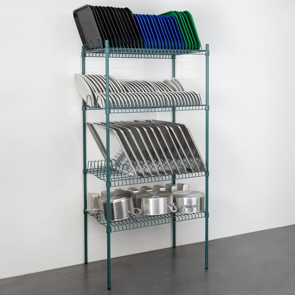 A Regency green wire rack with 4 shelves holding metal plates and pans.