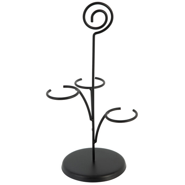A black metal stand with three round rings on it.