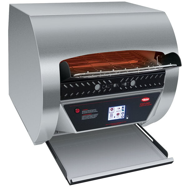 A silver Hatco conveyor toaster with a black digital panel.