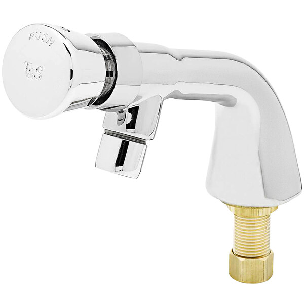 A silver T&S metering faucet with a gold nut.