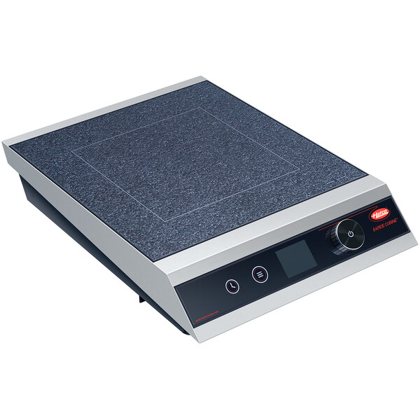 A close-up of a black and silver Hatco Rapide Cuisine countertop induction cooker with a digital timer.