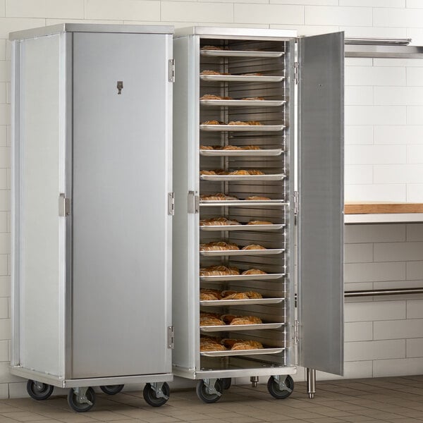 A white enclosed metal rack with trays of pastries.
