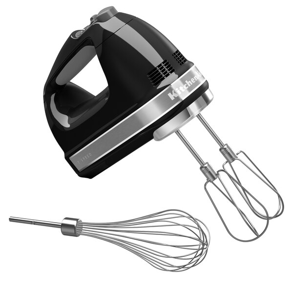 A black and silver KitchenAid hand mixer with stainless steel beaters and a whisk.