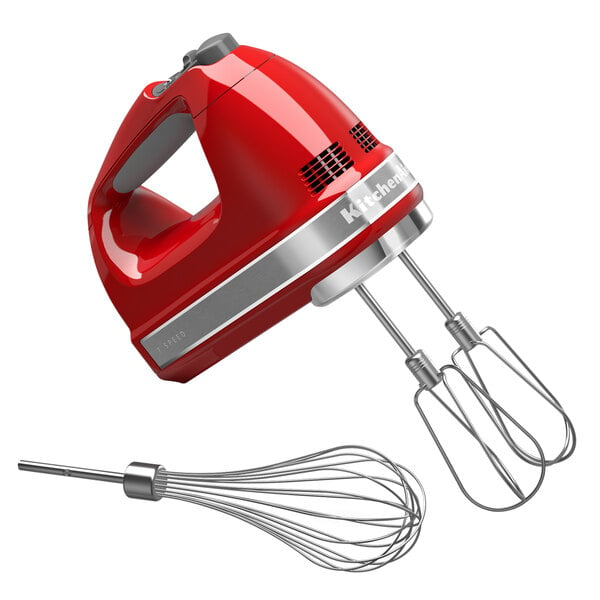 A red KitchenAid hand mixer with silver trim and a whisk attachment.