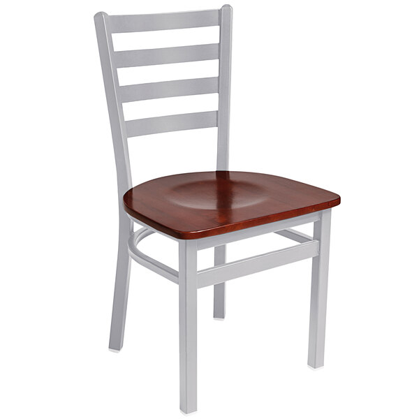 A BFM Seating steel side chair with a mahogany wooden seat.