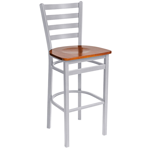 A BFM Seating steel bar stool with a cherry wooden seat.