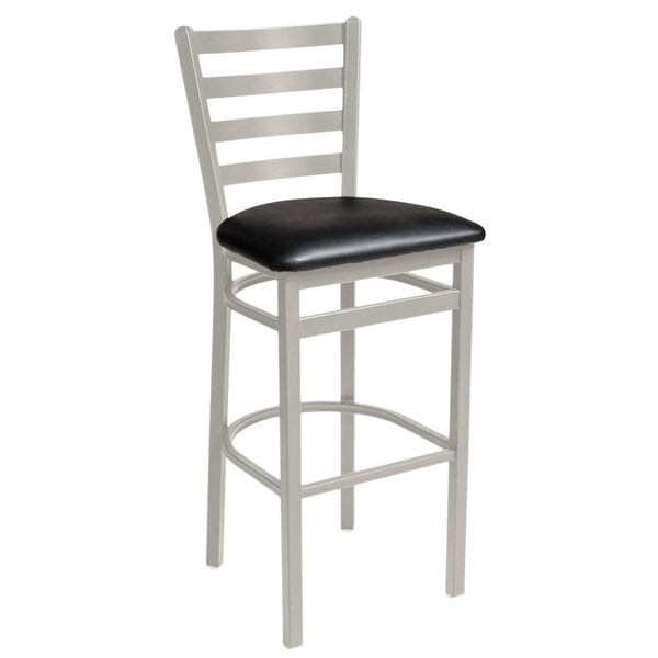 A BFM Seating Lima silver mist steel bar height chair with black vinyl seat.