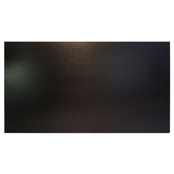 A rectangular BFM Seating table top in espresso with a light reflecting off the surface.