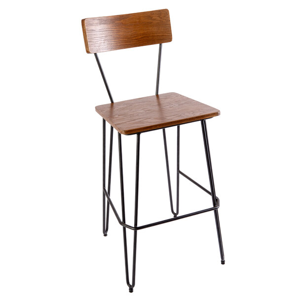 A BFM Seating barstool with a wooden seat and back on a sand black metal frame.