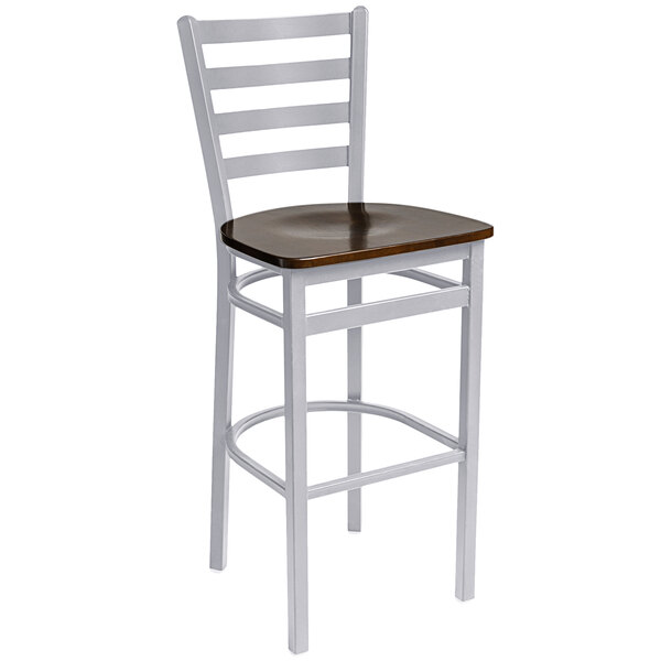 A BFM Seating metal bar stool with a walnut wooden seat.