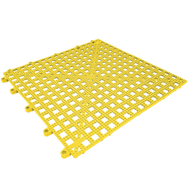 A yellow plastic grid mat with holes.