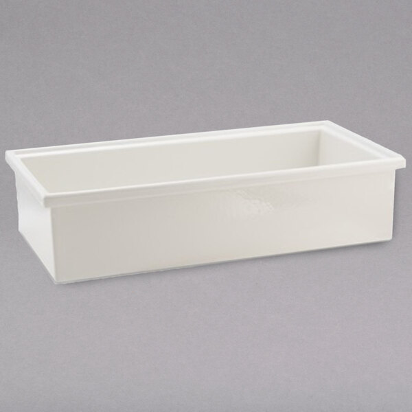 A white rectangular container with a lid on a gray background.