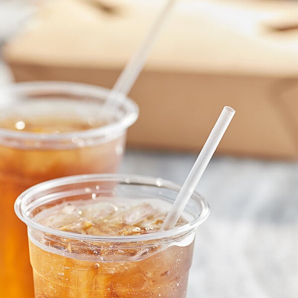 Two plastic cups of iced tea with Choice jumbo straws.