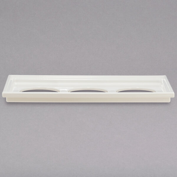 A white rectangular Bon Chef adapter plate with three small holes.