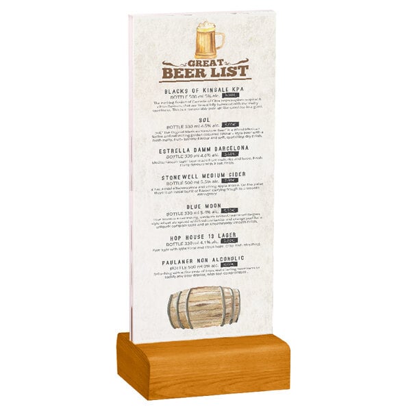 A Menu Solutions clear acrylic table tent with a solid country oak wood base holding a drink menu on a wood surface.