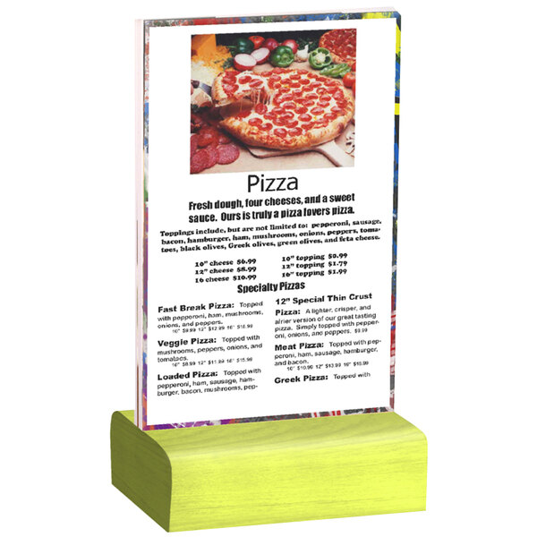 A Menu Solutions clear acrylic table tent with a solid lime wood base holding a pizza menu on a table.