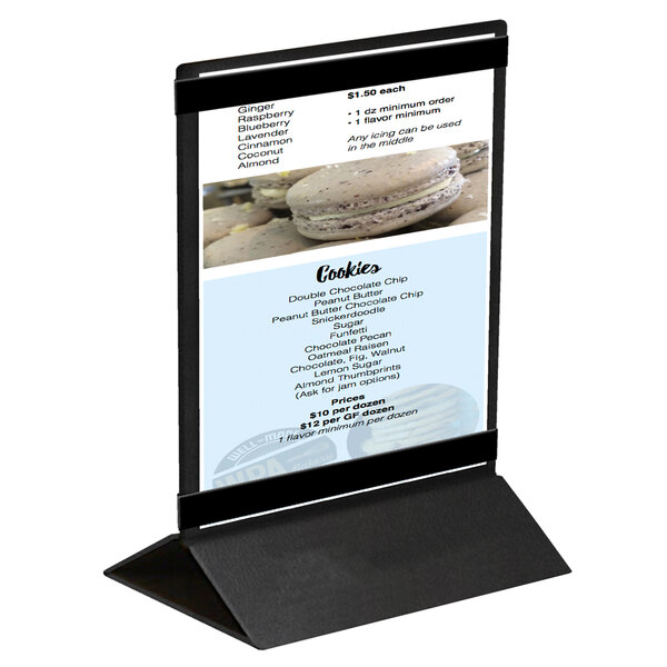 A black Menu Solutions table tent stand with a menu on it.