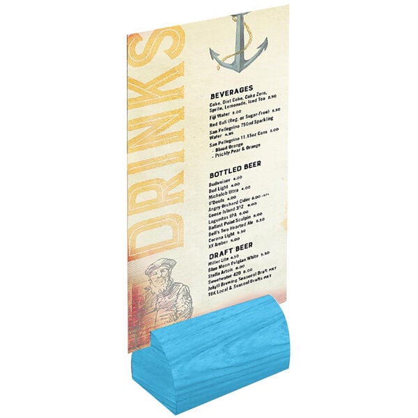 A sky blue wooden curved card holder with a menu on a table.
