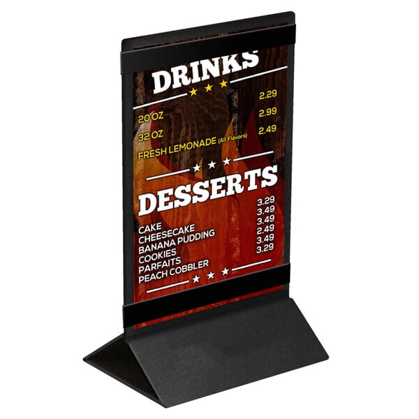 A black Menu Solutions table tent on a stand with white text.