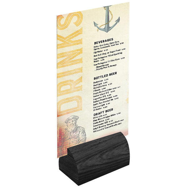 A black wood curved Menu Solutions card holder on a table with a menu card in it.