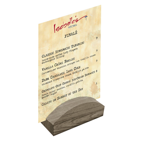 A Menu Solutions weathered walnut wood rounded card holder on a table with a menu on it.
