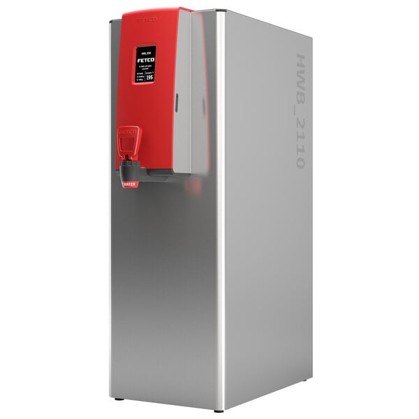 A silver and red Fetco hot water dispenser with a black touchscreen label.
