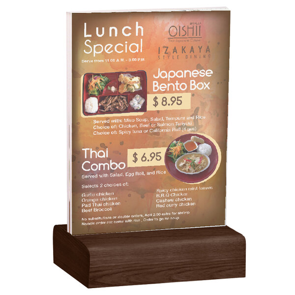 A Menu Solutions clear acrylic table tent on a solid walnut wood stand.