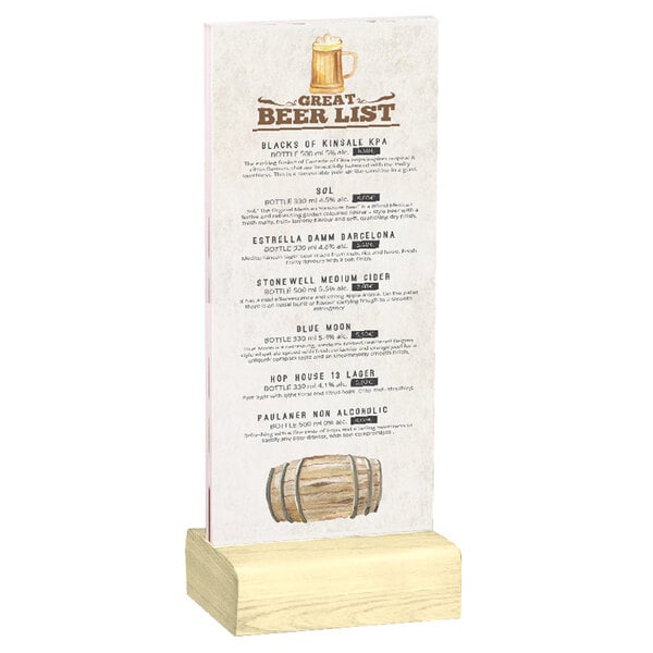 A Menu Solutions clear acrylic table tent with a solid natural wood base holding a drink menu on a wood surface.