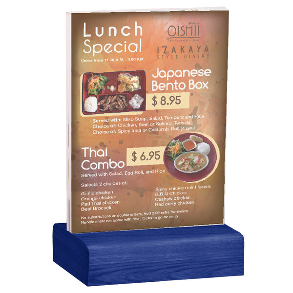 A Menu Solutions clear acrylic table tent with a blue wood base holding a menu.