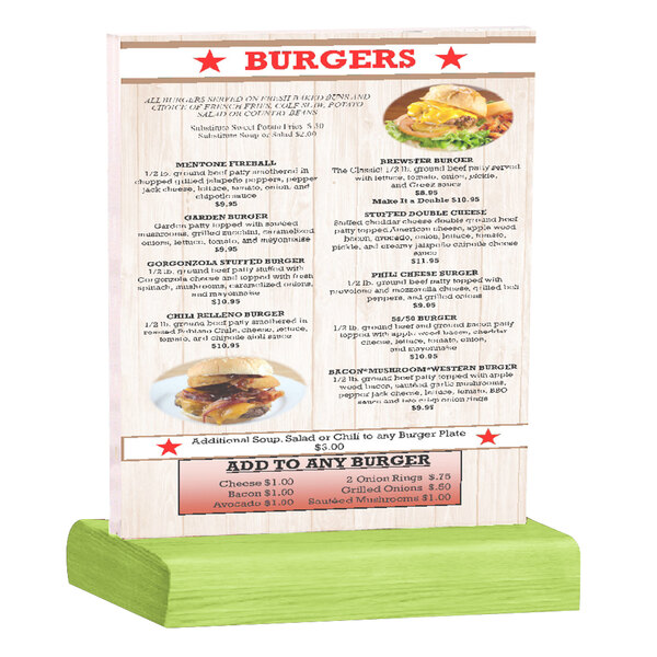 A Menu Solutions clear acrylic table tent with a solid lime wood base holding a menu on a table with a burger on it.