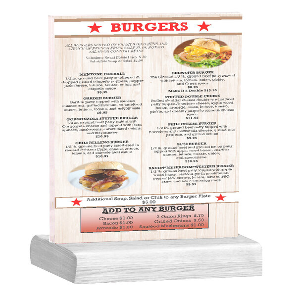 A Menu Solutions clear acrylic table tent with a white wash wood base holding a menu with a burger on it.