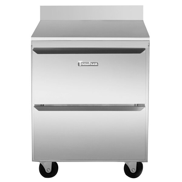 A stainless steel Traulsen worktop refrigerator with two drawers on wheels.