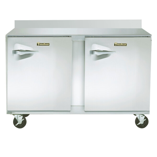 A large stainless steel Traulsen worktop freezer with two doors.