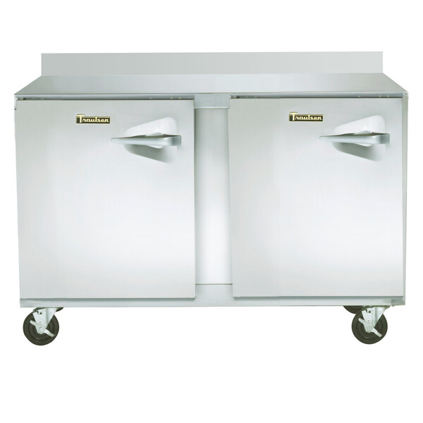 A large stainless steel Traulsen worktop freezer with two doors.