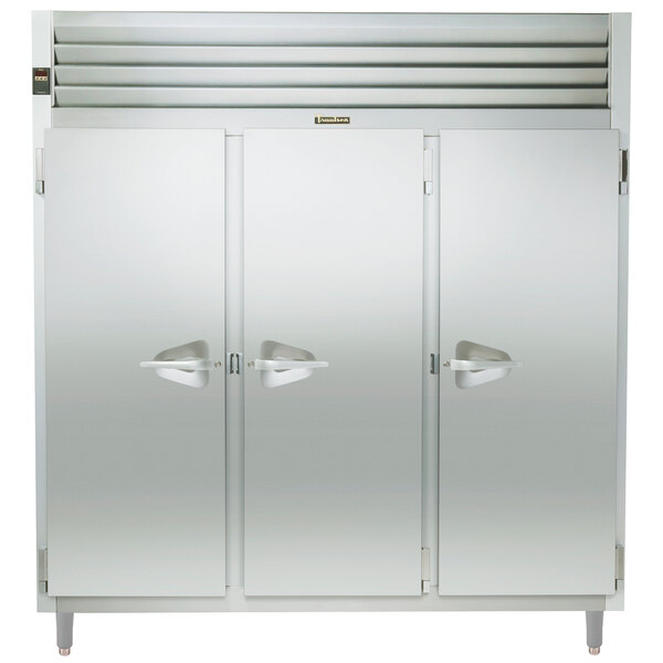 A Traulsen stainless steel reach-in heated holding cabinet with three doors open.