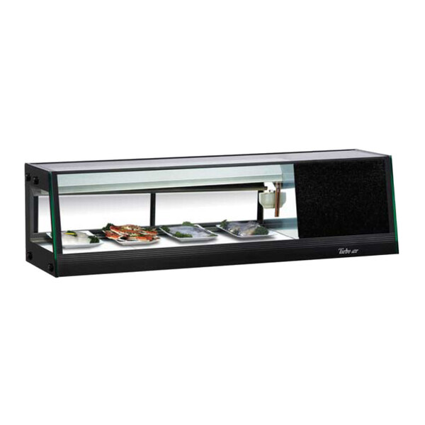 A black and white refrigerated sushi case with a glass top on a counter.