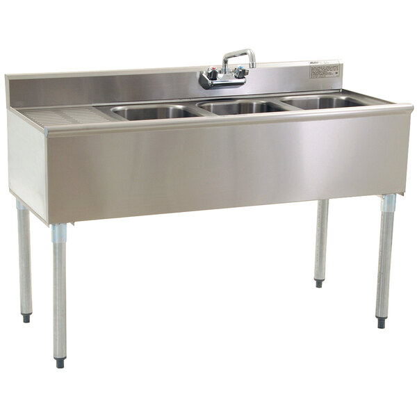 An Eagle Group stainless steel underbar sink with three bowls and a faucet on the left.