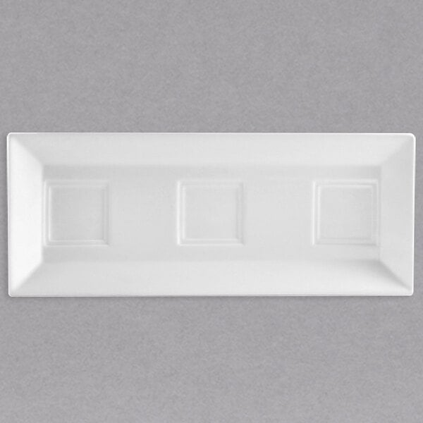 A white rectangular porcelain tray with 3 square bowl holders.