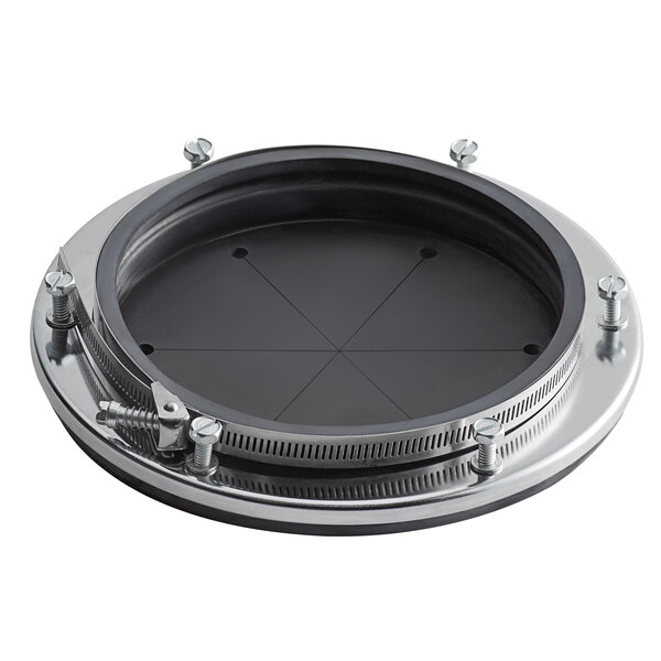 A black and silver circular metal plate with screws.