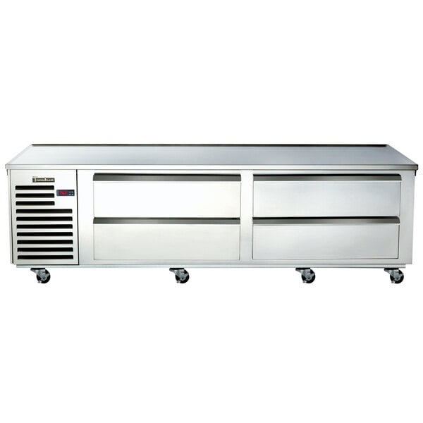 A Traulsen stainless steel commercial chef base with four freezer drawers on wheels.