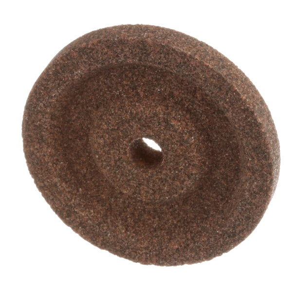 A Globe sharpening stone with a circular brown grinding wheel.