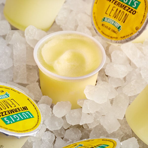 A group of Luigi's Intermezzo Lemon Italian Ice cups on ice.
